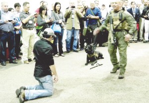 One of the afternoon events worth allowing extra time for was the exhibition of the security team of Garcia and Max at work. (Max is 100 pounds of exceptionally trained giant schnauzer.) The suspect and Garcia talking, and Max watching and waiting for the command. Garcia asked several people, and then the crowd, to yell “Attack!” Max never moved until Garcia said the word, and then he went.  