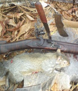 A .32 cal. rifle, thin blade knife and small hatchet—plus squirrel—makes a meal.