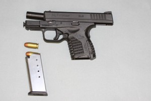 This image posted by the Seattle Police on their "Blotter" website shows the gun recovered at the scene of a shooting that resulted in the death of a repeat offender. (SPD photo)